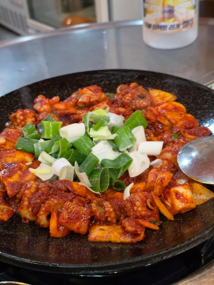 Seoul Jjukkumi, near Nonhyeon Station — webfoot octopus and pork belly on a table pan, ₩16,000 a portion — Seoul Jjukkumi Jamwon