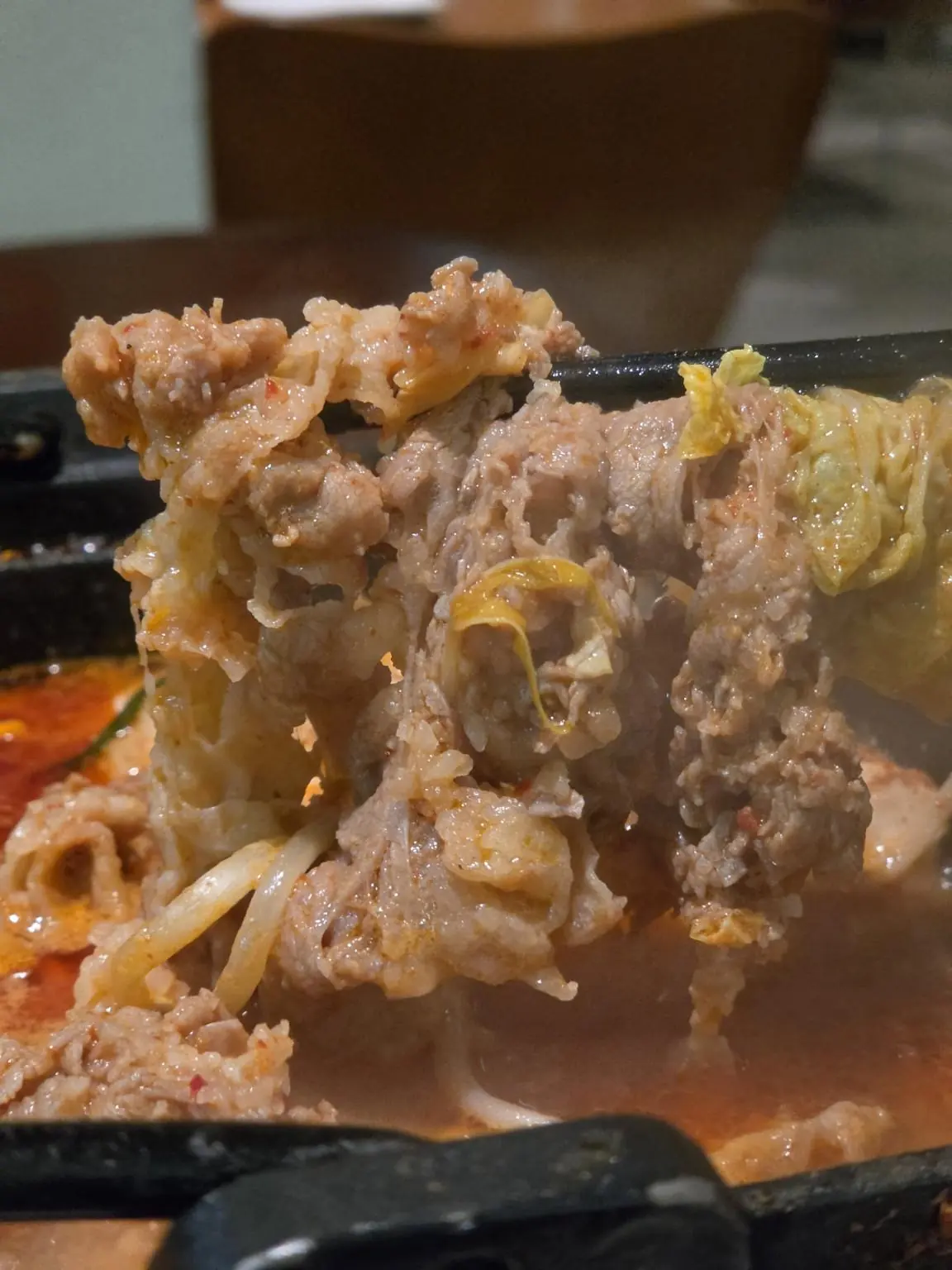 Lifting meat from the bubbling nabe — Tanju (탄주) Yakitori, Express Bus Terminal branch 2