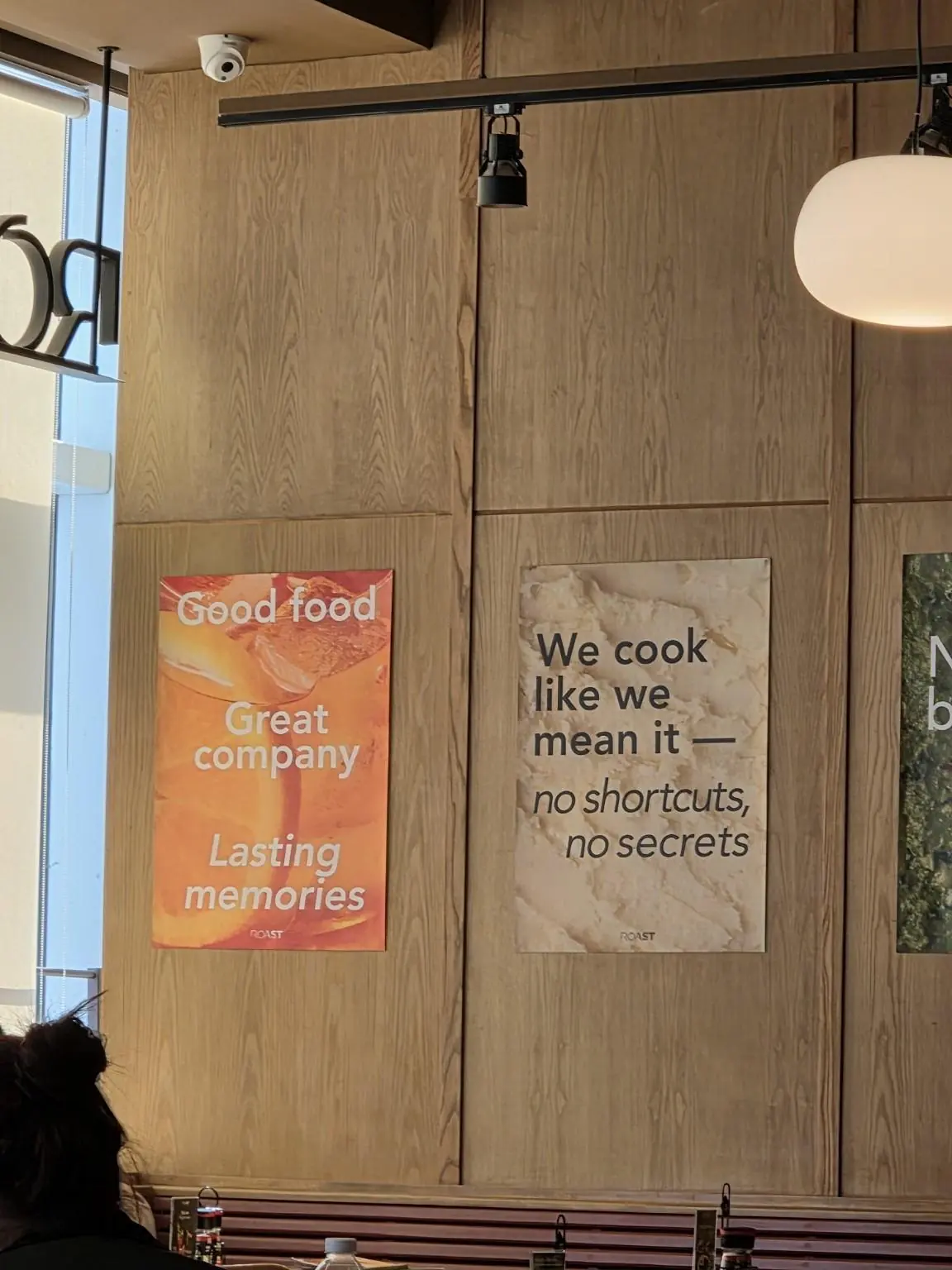 A wooden wall and ROAST posters. — ROAST, Bangkok