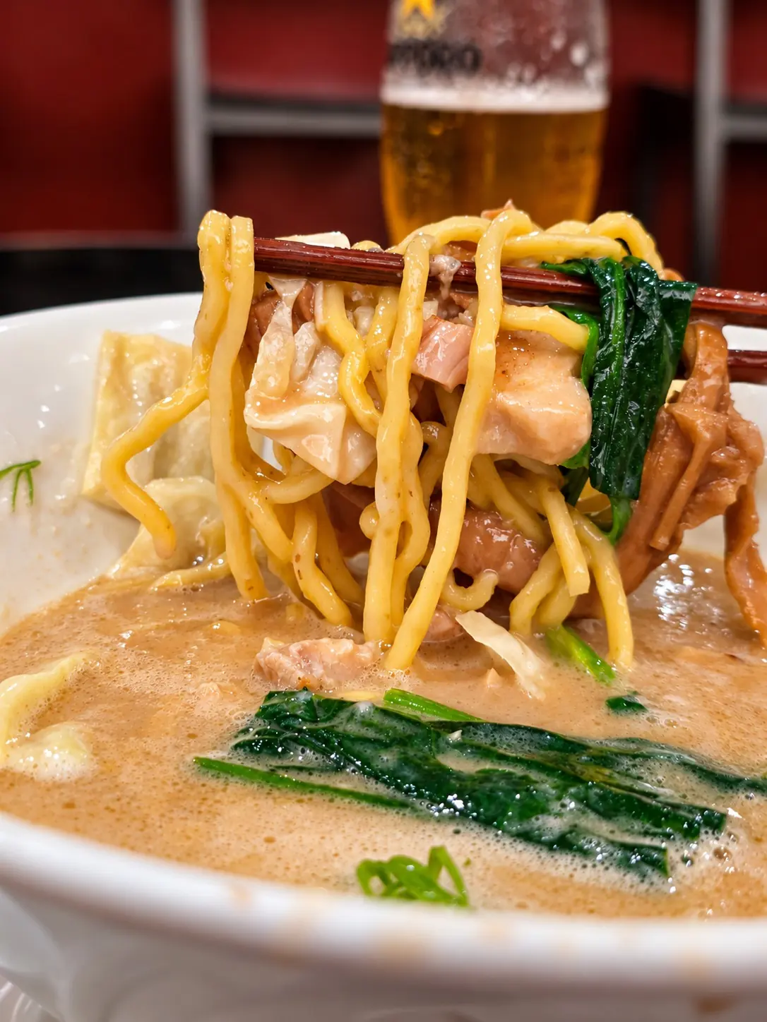 麺とトッピングが見えるラーメンのアップ 🍜 — MENSHO TOKYO, Sukhumvit 31, Bangkok