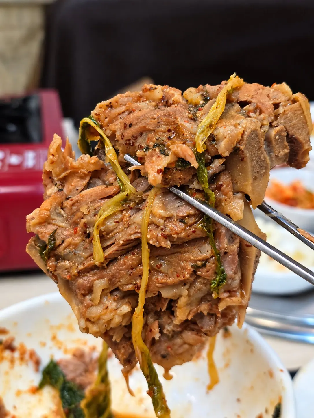 Picking the meat off the bone. — Dae Jang Geum, Prasanmit Plaza, Sukhumvit Soi 23, Asok, Bangkok