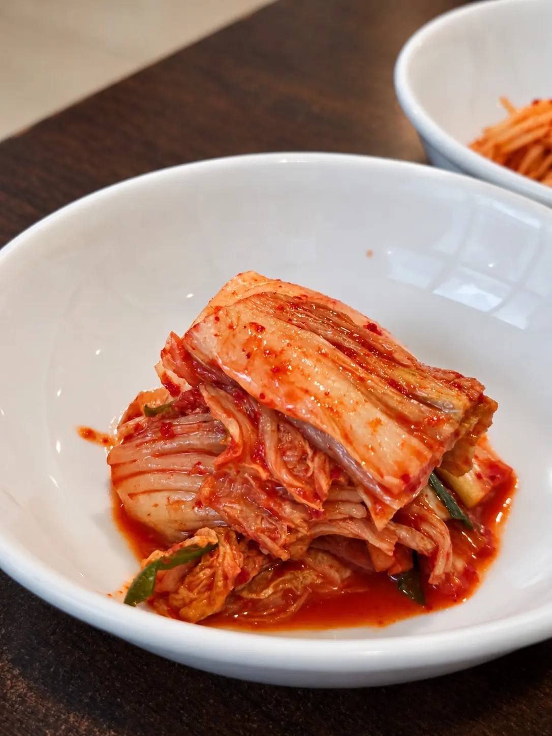 一起上桌的白菜泡菜。🥬 — Manchan Korean Restaurant (2nd floor), Phrom Phong, Bangkok