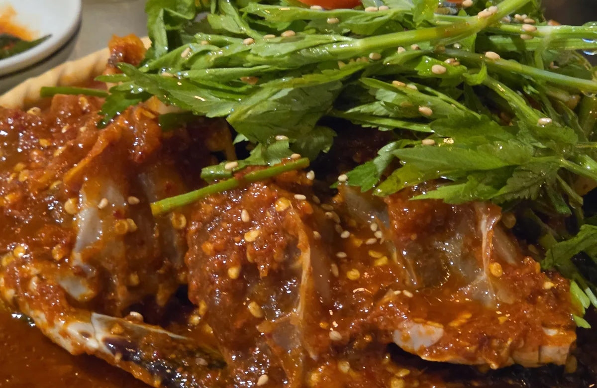 Spicy crab topped with fresh minari at Haehwaok