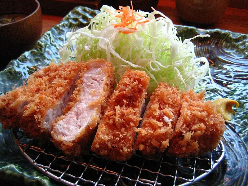 Breaded pork cutlet with shredded cabbage