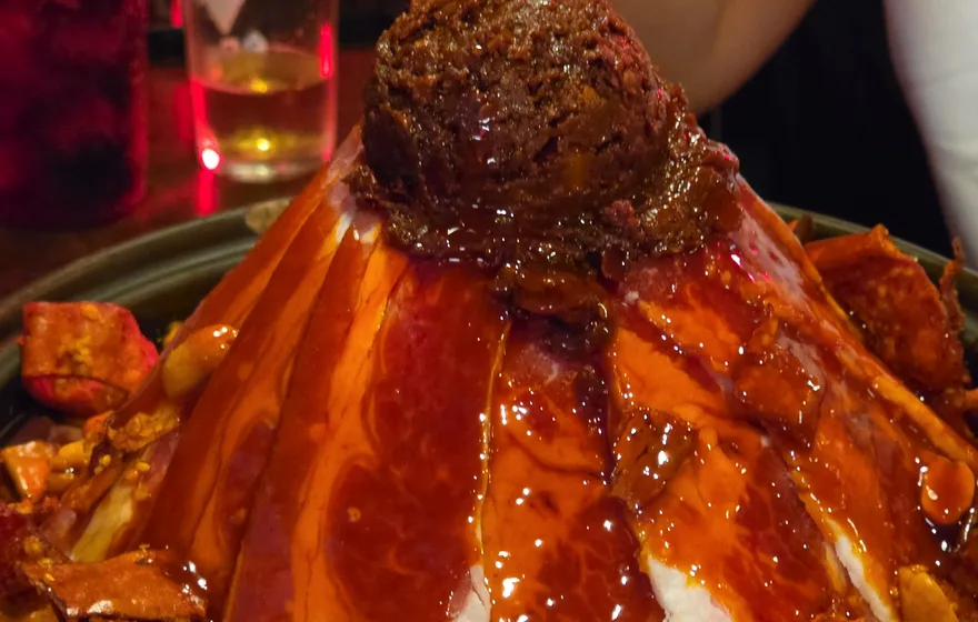 Volcano mala hot pot at Yongyong Seonsaeng Nonhyeon — sliced meat piled into a peak with mala paste on top